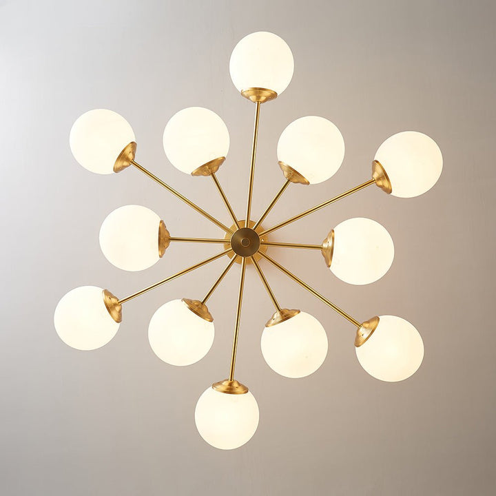 This 12-Light Tired Brass Sputnik Chandelier adds a mid-century modern feel to any room, with brass metal and opal glass shades for a unique yet timeless look. Its milky glass shades evenly distribute light to create bright and cozy illumination perfect for kitchen and dining room lighting.