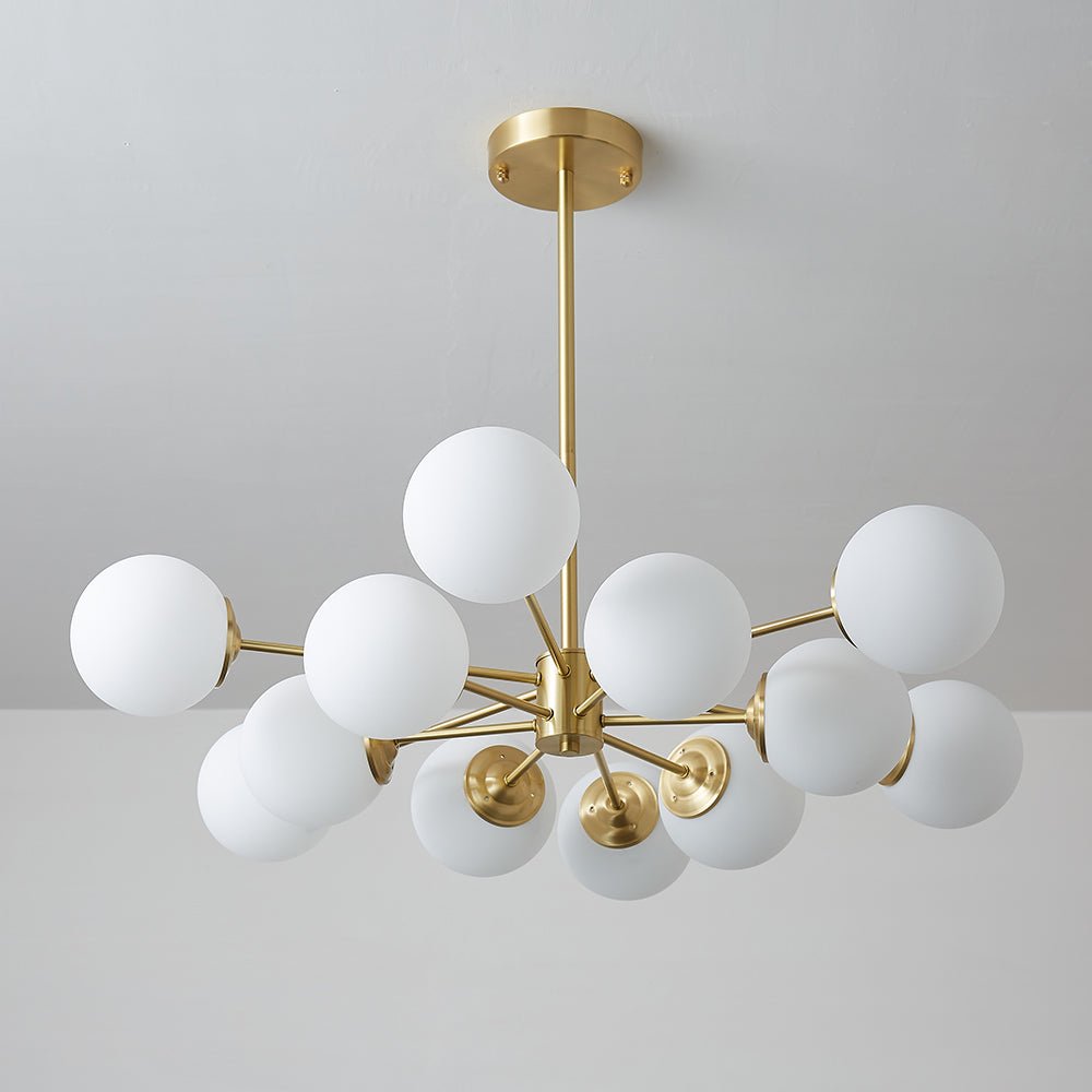 This 12-Light Tired Brass Sputnik Chandelier adds a mid-century modern feel to any room, with brass metal and opal glass shades for a unique yet timeless look. Its milky glass shades evenly distribute light to create bright and cozy illumination perfect for kitchen and dining room lighting.