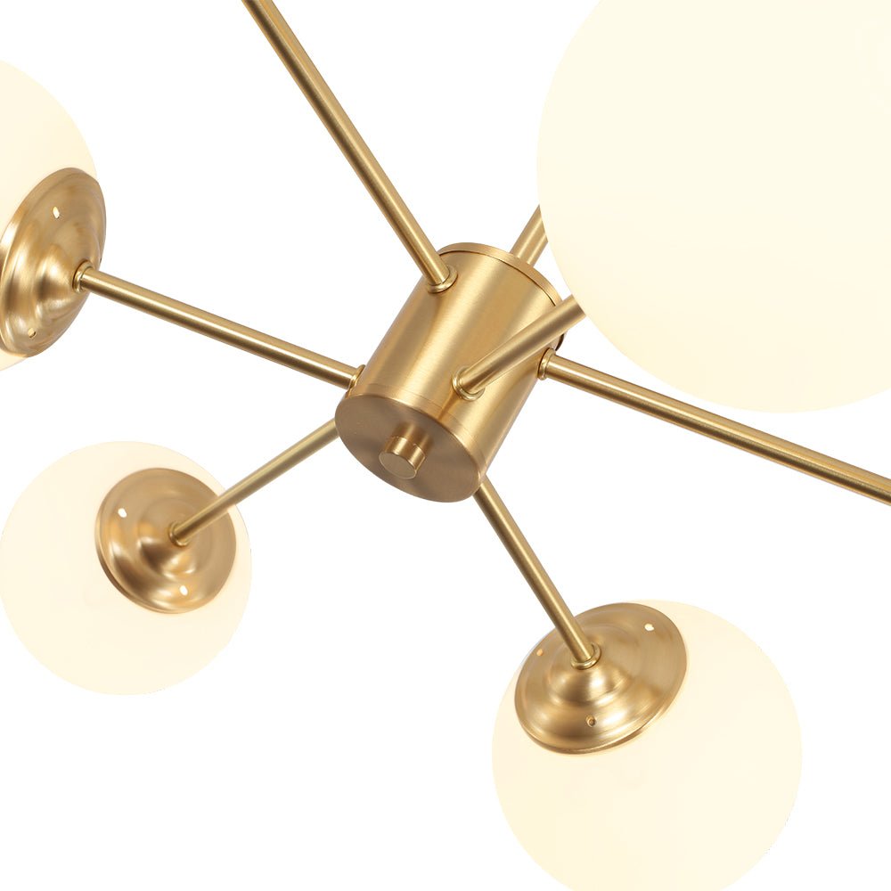 This 6-Light Tired Brass Sputnik Chandelier makes a statement with its mid-century modern flair. Featuring milky opal glass shades and a brass metal finish, this chandelier is perfect for adding a touch of style and elegance to any home. Ideal for dining rooms and kitchens, this light fixture is sure to add a touch of sophistication to any space.