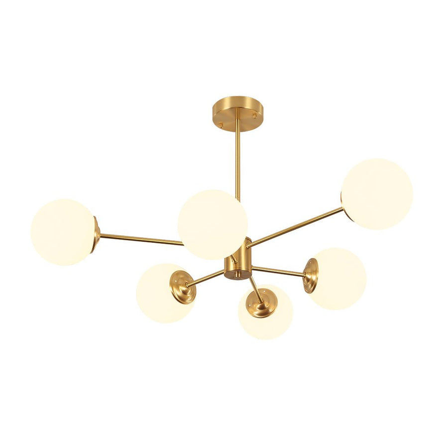 This 6-Light Tired Brass Sputnik Chandelier makes a statement with its mid-century modern flair. Featuring milky opal glass shades and a brass metal finish, this chandelier is perfect for adding a touch of style and elegance to any home. Ideal for dining rooms and kitchens, this light fixture is sure to add a touch of sophistication to any space.