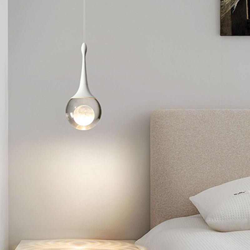 Light up your bedroom with our stunning 1-Light Mini Teardrop Glass Pendant Light! The stunning crystal glass shade houses a beautiful moon sphere, adding a touch of sophisticated elegance to any space. With an integrated 5-watt LED, and 3000K soft warm light, this bedside pendant lamp is sure to create the perfect ambiance. Create an awe-inspiring scene with this stunning pendant light!