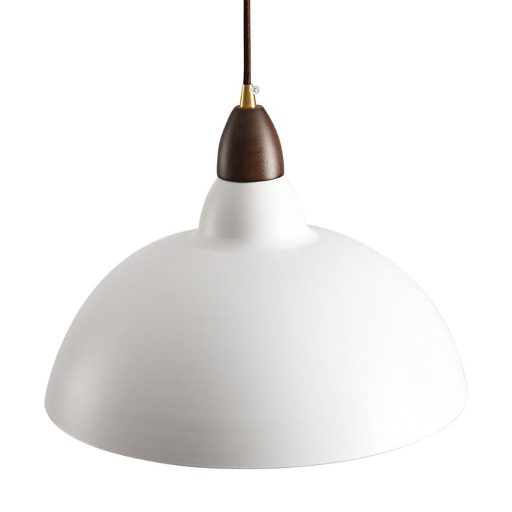 Light up your kitchen island or dining table with the 1-Light Modern White Dome Pendant Light! The sleek modern design complements any modern space while the wood accents add warmth. The dome shape casts a warm light in your kitchen, creating an inviting and comforting atmosphere. Illuminate your kitchen with this modern and stylish pendant light!