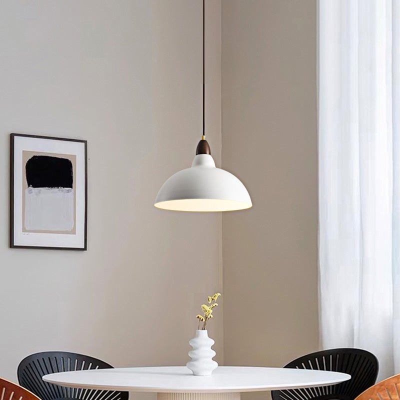 Light up your kitchen island or dining table with the 1-Light Modern White Dome Pendant Light! The sleek modern design complements any modern space while the wood accents add warmth. The dome shape casts a warm light in your kitchen, creating an inviting and comforting atmosphere. Illuminate your kitchen with this modern and stylish pendant light!