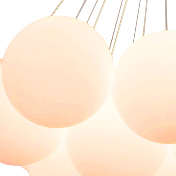 Dazzle any room in your home with this 13-Light Cluster Cloud Chandelier with Milk Globe Shade! Hand-blown Opal Glass globes, G9 bulbs, and a cluster globe design create a unique, elegant cloud shape with soft ambient light perfect for a nursery room or kid's room lighting decor. Add style and sophistication to any space with this enchanting chandelier!