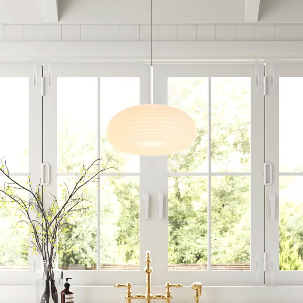 Experience the perfect blend of elegance and modernity with this stunning LED Ribbed Round Pendant Light. Its beautiful ribbed shade and fine-fluted detailing provide a sophisticated and luxurious touch to your living room or dining room. The three color temperature modes allow you to customize the light to your desired atmosphere. Make this piece the star in your home.