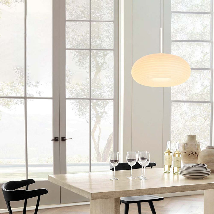 Experience the perfect blend of elegance and modernity with this stunning LED Ribbed Round Pendant Light. Its beautiful ribbed shade and fine-fluted detailing provide a sophisticated and luxurious touch to your living room or dining room. The three color temperature modes allow you to customize the light to your desired atmosphere. Make this piece the star in your home.