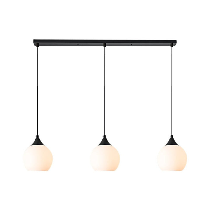 Make a stylish statement in your kitchen with the 3-Light Linear Pendant with Opal Globe Glass Shade. Featuring a sleek black metal frame with three elegant milky glass globes, this modern-looking linear pendant light will provide beautiful illumination above kitchen islands or counters. Create a shining, inviting atmosphere that will leave your guests in awe!