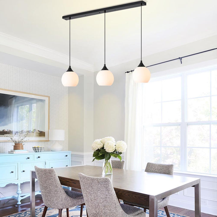 Make a stylish statement in your kitchen with the 3-Light Linear Pendant with Opal Globe Glass Shade. Featuring a sleek black metal frame with three elegant milky glass globes, this modern-looking linear pendant light will provide beautiful illumination above kitchen islands or counters. Create a shining, inviting atmosphere that will leave your guests in awe!