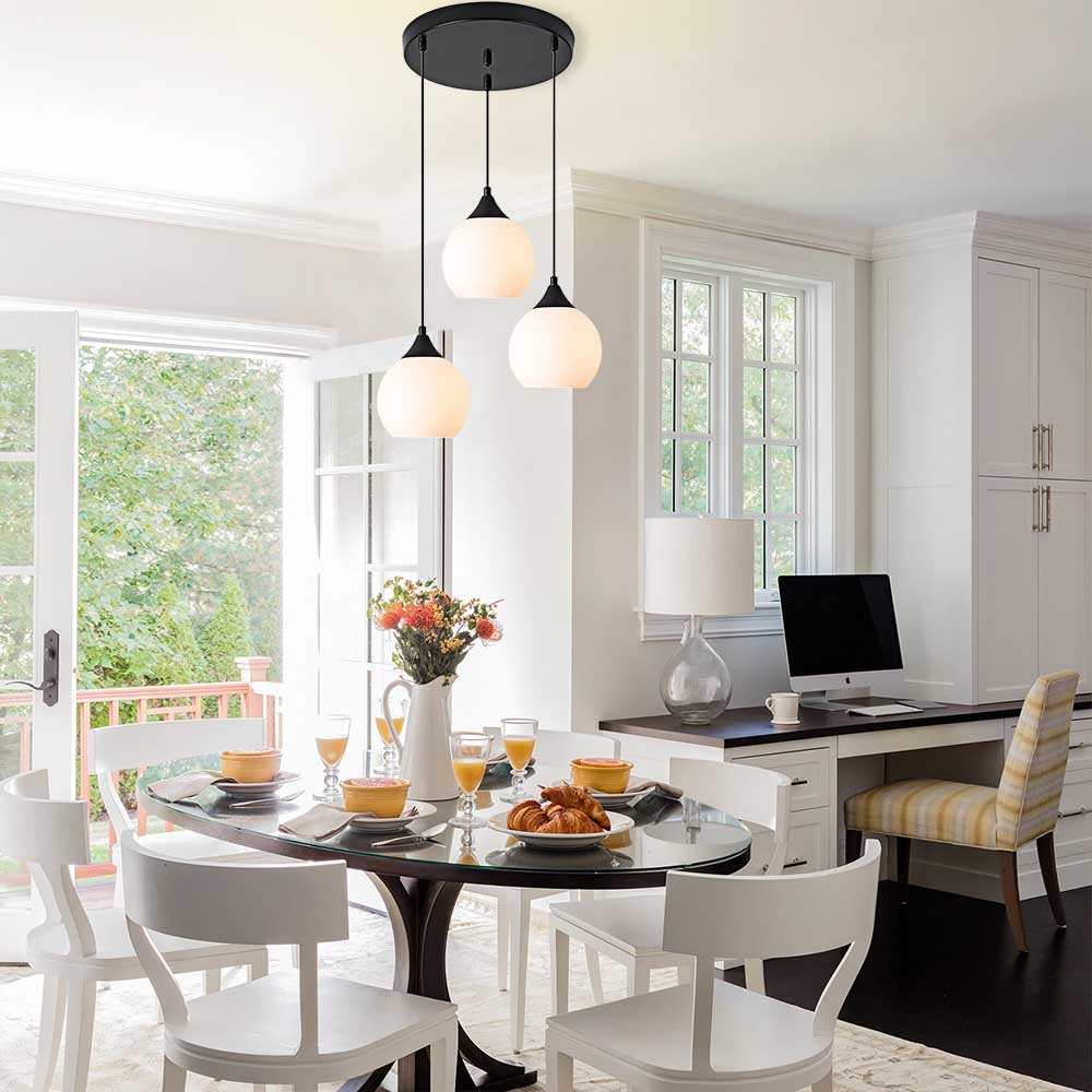 Adorn your kitchen island or dining room with this modern 3-light pendant. The round canopy and milky glass shades evoke an air of sophistication, while the black metal finish creates a sleek, contemporary look. Illuminate your space with this stylish and functional light fixture!