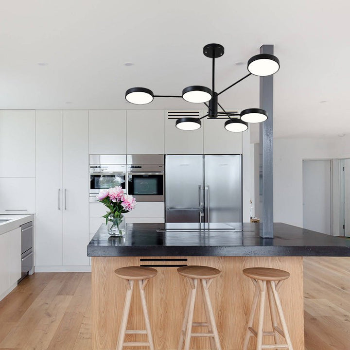 Create your own modern atmosphere with this eye-catching 6-Light LED Sputnik Chandelier. With 6 round heads extended from two layered arms and an adjustable downrod, it can easily bring extra style and energy efficiency to any room. Its sleek black metal frame and unique sputnik design make it perfect for your dining room or kitchen island. Illuminate your life with this dynamic