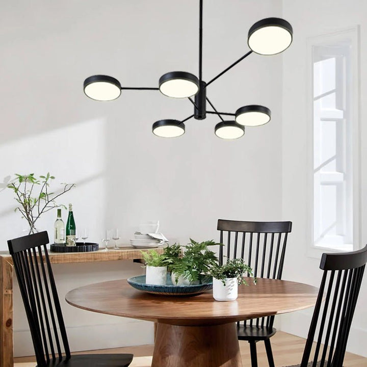 Create your own modern atmosphere with this eye-catching 6-Light LED Sputnik Chandelier. With 6 round heads extended from two layered arms and an adjustable downrod, it can easily bring extra style and energy efficiency to any room. Its sleek black metal frame and unique sputnik design make it perfect for your dining room or kitchen island. Illuminate your life with this dynamic