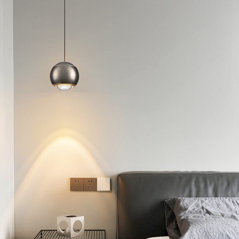 Update your living space with this contemporary 1-Light Mini Globe Spot Pendant Light! With an adjustable mini globe shape, spotlight, and auto lifting kit, this stylish pendant light provides task lighting in an array of modern colors, perfect for bedside and wall picture lighting. Experience convenience with an easy-to-use design!