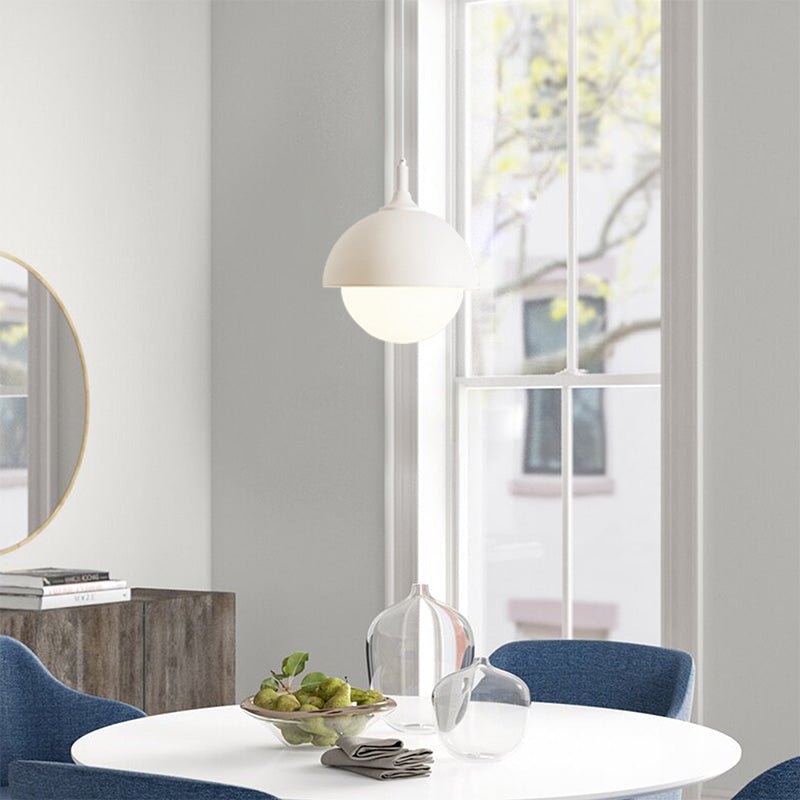 Light up any space with the Nordic Modern 1-Light Globe Pendant Light. This stylish metal dome pendant light features a dome shade holder and an opal glass diffuser, emitting a soft warm light perfect for any bedside, dining room, or kitchen island. With a modern black or modern white finish, this pendant light is sure to add a touch of modern elegance to your home.