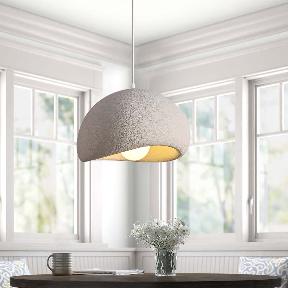 Bring an exclusive touch of style to your home with this sleek 1-Light Textured Ceramic Dome Pendant Light. The dome shade, dotted with handcrafted concrete texture, creates a sophisticated nordic modern design that will complement any bedroom, dining room, or kitchen island. Elevate the atmosphere of your space with this luxurious piece.