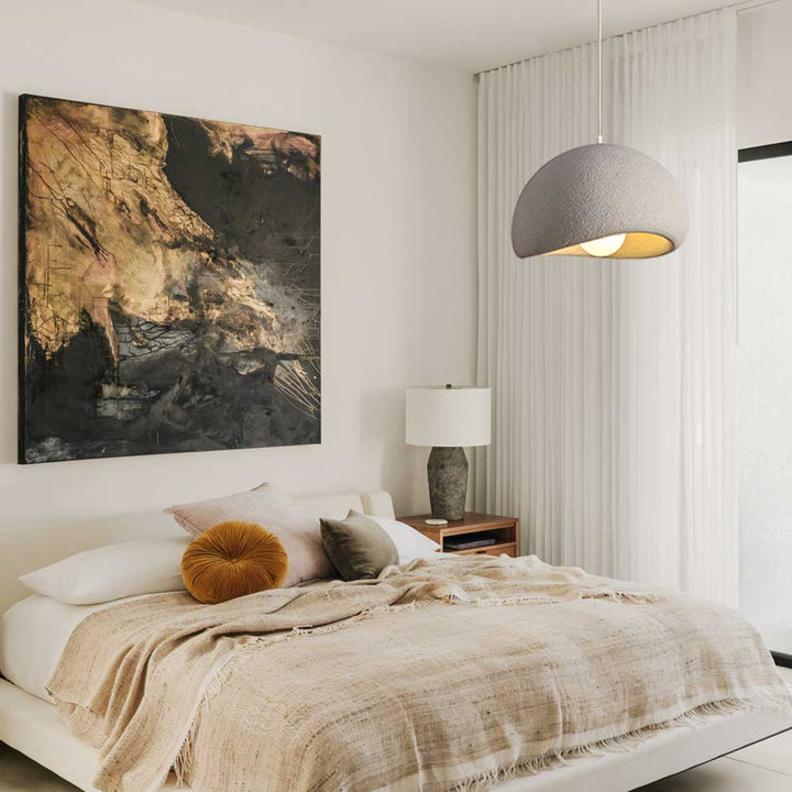 Bring an exclusive touch of style to your home with this sleek 1-Light Textured Ceramic Dome Pendant Light. The dome shade, dotted with handcrafted concrete texture, creates a sophisticated nordic modern design that will complement any bedroom, dining room, or kitchen island. Elevate the atmosphere of your space with this luxurious piece.